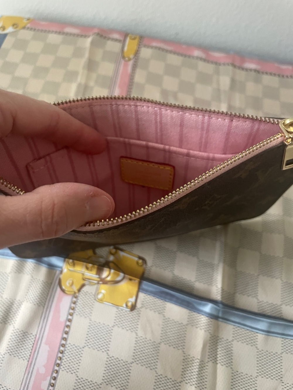 Monogram wristlet with soft pink interior